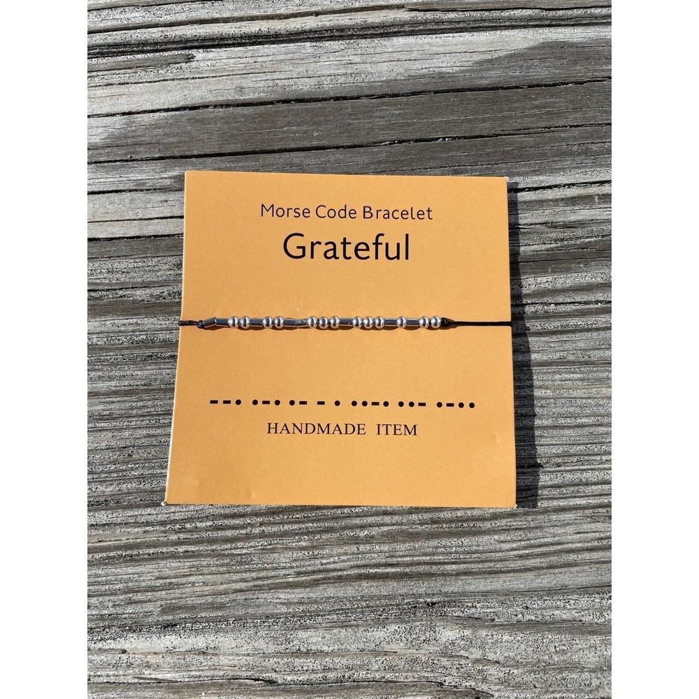 “Grateful” in Morse Code with beads on an adjustable string bracelet
